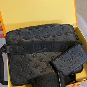 - Louis Vuitton Cross body bag
